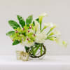 in a glass vase combination of white and green flowers