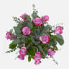 1 Dozen Purple Roses filled with eucalyptus and salal in a Bouquet