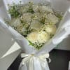 A timeless arrangement of premium white roses accented with delicate chamomile daisies