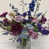 This arrangement contains a variety of purple and lavender flowers.  