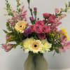 Beautiful seasonal flowers in spring shades of pinks and yellows.