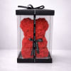 Red rose teddy bear in a clear gift box with a black ribbon