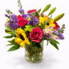 A radiant celebration of color and emotion, this vibrant arrangement brings together