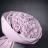 Bouquet of pale lavender roses wrapped in pink paper