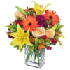 Featuring gorgeous yellow lilies, peach roses, orange gerberas, fuchsia carnations, pale peach