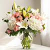 Embrace the serene beauty of our elegant arrangement featuring  white hydrangeas