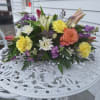 Lavender Stock, pink lilies, pink tulips, yellow carnations and, peach garden roses