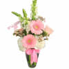 Gerbera daisies, roses and snapdragons make this bouquet ever so dainty.