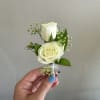 Photographed is an examples of a standard all white boutonniere*,  you