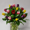 Select this clear glass cylinder with a colorful array of tulips and