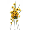A radiant standing spray designed with vibrant sunflowers, rich golden tones, and
