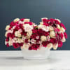 Celebrate Valentine's Day with a stunning flower arrangement featuring delicate ranunculus and