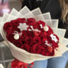 Two dozen red long-stem roses with adorable Christmas ornaments to spread holiday