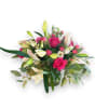 Pink roses and white lilies arranged in a glass vase