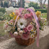 A bright and cheerful basket arrangement, Summer Sunrise brings together ranunculus, chamomile