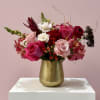 A delicious blend of hot pink, light pink, and blush blooms arranged