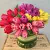 Bouquet of multicolored tulips in a glass vase
