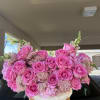 An elegant and striking bouquet arranged in a charming basket, featuring lush