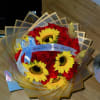 Our Radiant Passion arrangement combines deep red roses with vibrant sunflowers, symbolizing