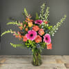 Lush and full of color, our Rainbow Bright arrangement is perfect for