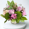 Flower arranment in vase with lavender roses, alstromeria, Dianthus green, filler and