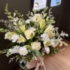 Express love, remembrance, and sympathy with the Pure white Floral Basket, a