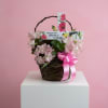 A medium garden basket with fresh alstroemeria. Includes a solar-powered memorial stake