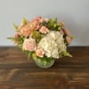 This beautiful arrangement of whites and peaches, pinks with a touch of