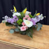 Spring Whisper is a graceful arrangement featuring soft pink roses, elegant white
