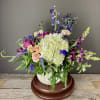 Our Spring Rain arrangement features flowers in shades of blue and purple