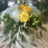 Brighten any space with our stunning floral arrangement featuring vibrant yellow roses