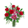 Red roses and pink lilies in a clear glass vase