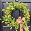 A 22&rdquo; wreath in bright sunny yellow with a bright spring bow.