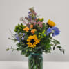 Soar into the wildflower meadows with this airy arrangement in a beautiful