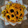 12 sunflowers  beautiful bouquet  wrapping whit white paper.