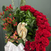 A beautiful and heartfelt arrangement featuring rich red roses, fresh greenery, and