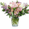 Stock, hydrangea, roses, alstromeria, daisy poms, carnations, spray roses, lavender monte and