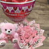Pink rose bouquet with a teddy bear and heart-shaped Valentine balloon