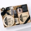 Gift box with lavender soap, spray, scrub, and balm tied with black ribbon