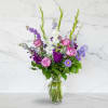 Cherish your memories with this lasting remembrance of lavender larkspur, roses, deep