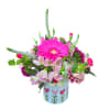 Featuring a lovely mix of shades of pinks, this vibrant arrangement is