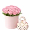 Soft blush pink roses designed in a modern pink hat box, creating