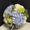An elegant option for any occasion. Mixed hydrangea's en masse delivered in