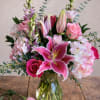 Everlasting Heart Blooms is a romantic stargazer lily and rose flower arrangement
