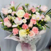 

A romantic hand-tied bouquet featuring soft pink roses, white roses, tulips, carnations