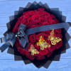 48 long red roses wrapped in black paper with butterflies and a