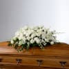 An all white tribute, this full casket spray is pure and tranquil.