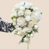 Romantic, luxurious, and gracefully dramatic &mdash; this all-white cascading bouquet is designed