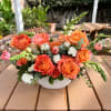 - 10 Orange Roses
- Fillers and Greenery
- White Ceramic Vase