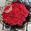 Large bouquet of red roses with a jeweled crown topper